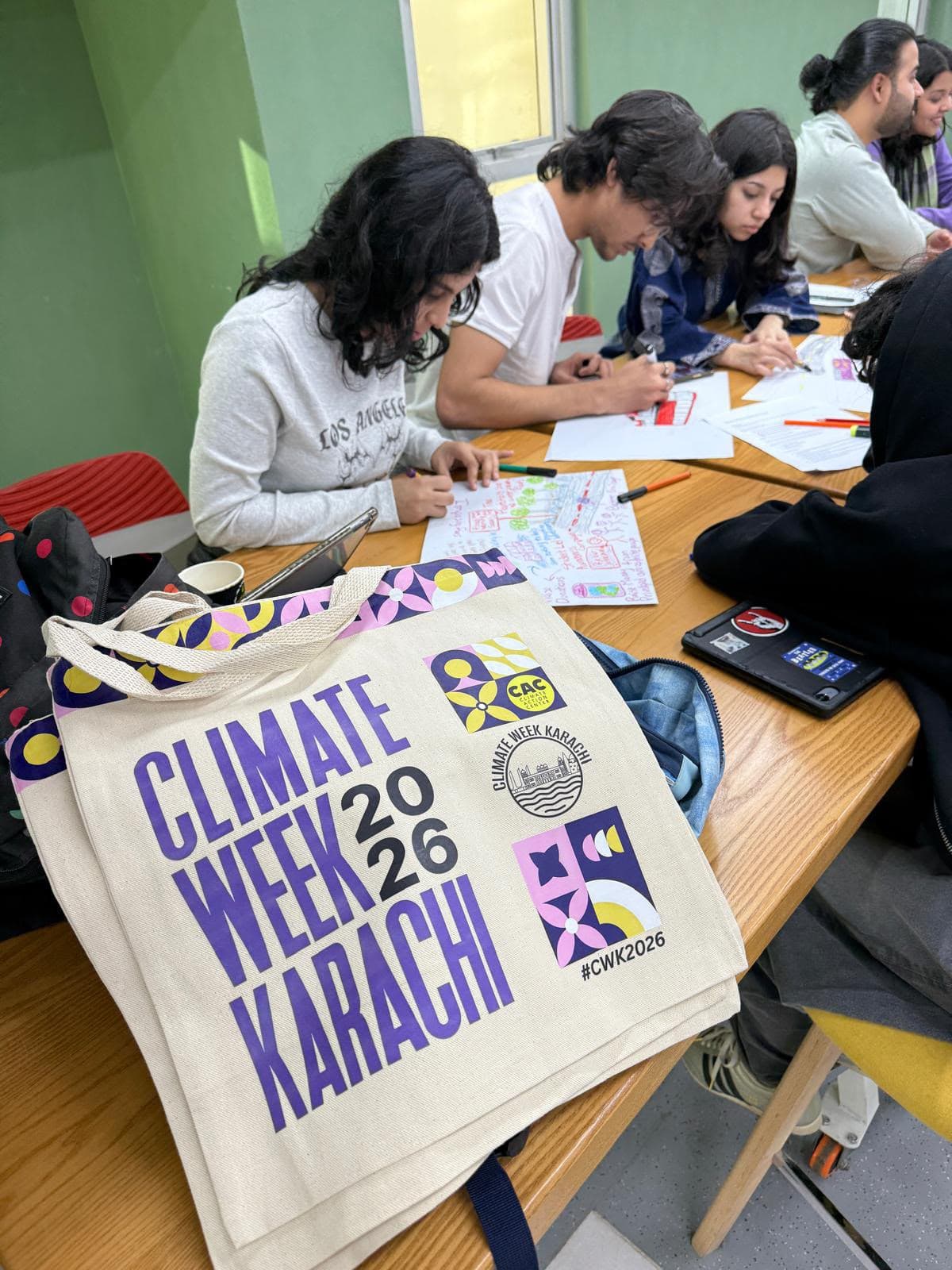 Custom Climate Week Karachi tote bags at a creative community workshop