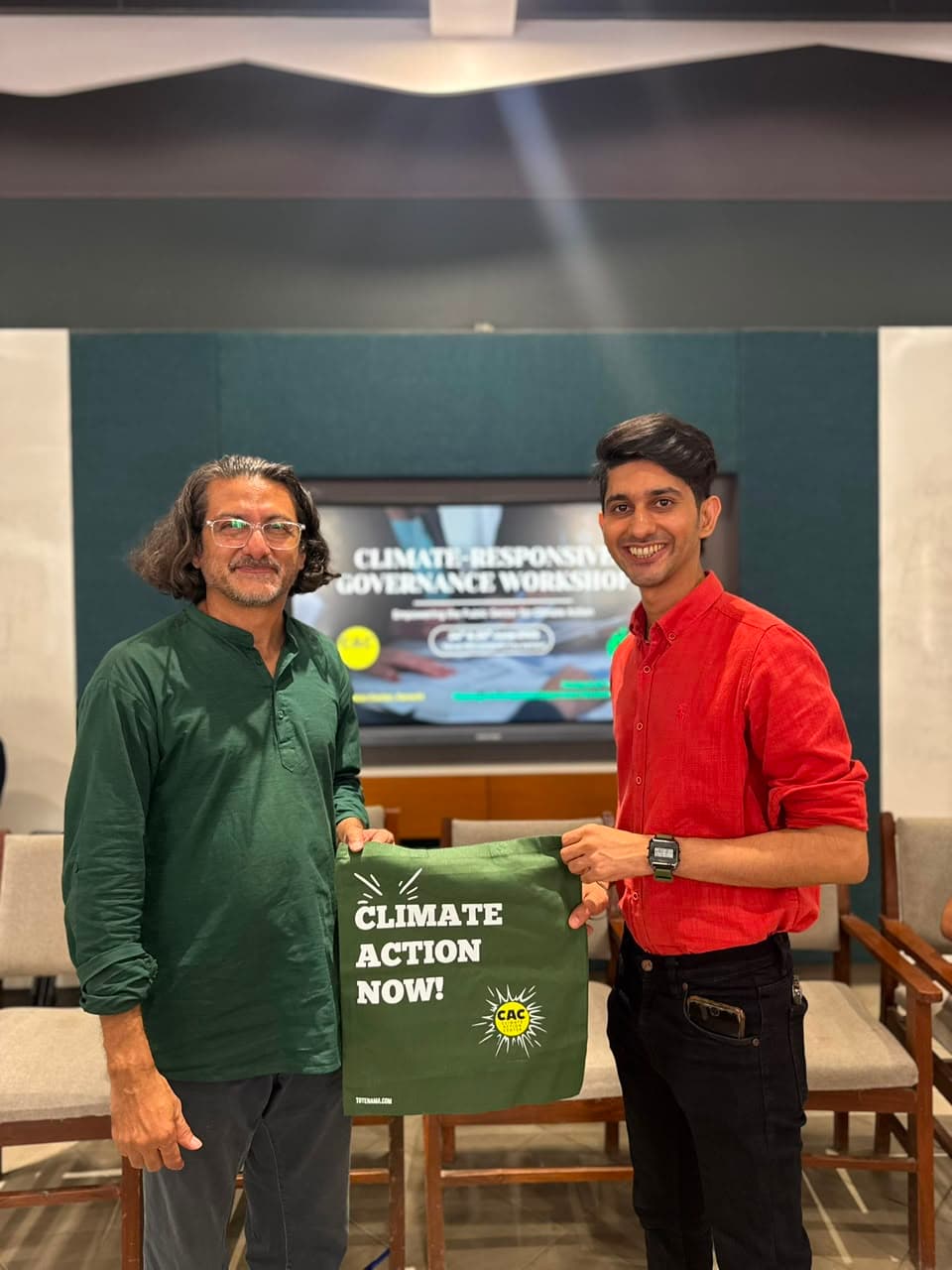 A Climate Action Now shirt presented at a community event